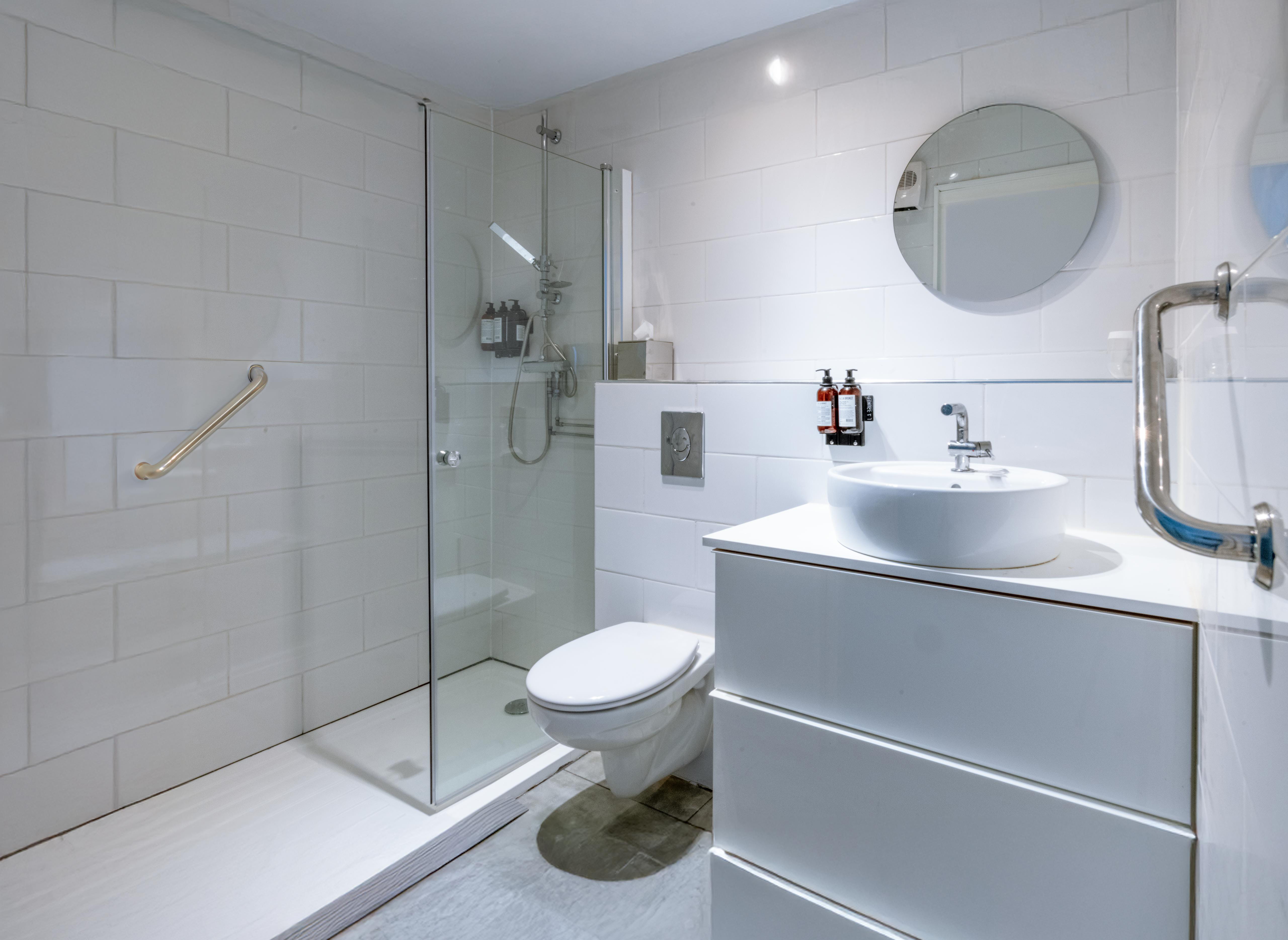 Room 8 — adapted guest room with widened doorways and assisted bathroom rails