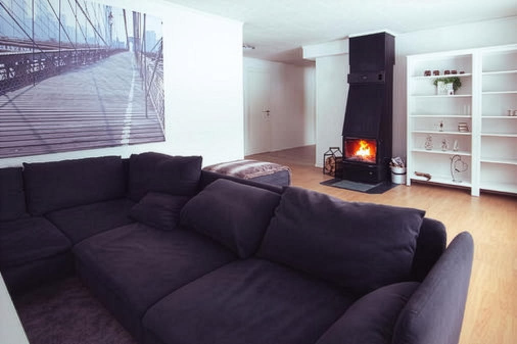 Spacious lounge with open wood fire