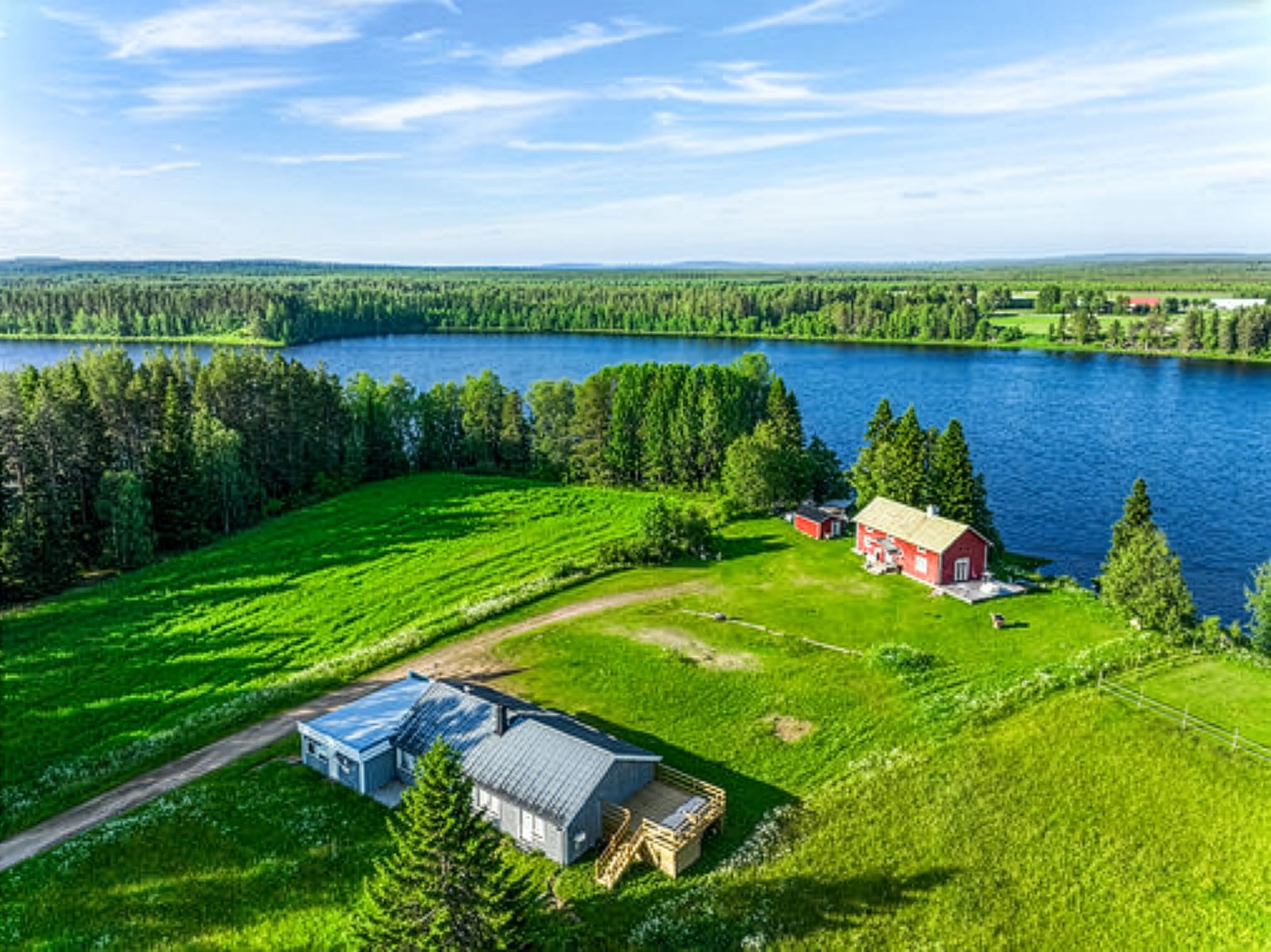 Aerial view of SBC Guest House grounds with river and meadow